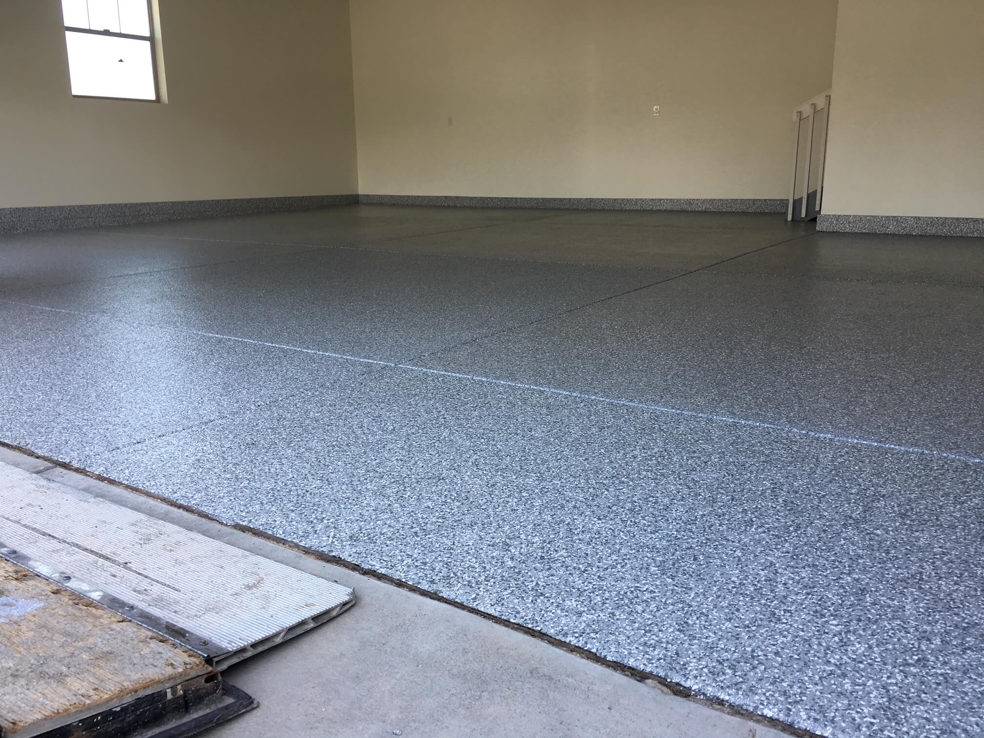 Epoxy concrete coating in Omaha for garage floors, basements, and commercial spaces.