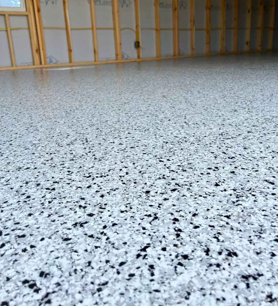 Durable epoxy floor coating installed in a residential Omaha garage.