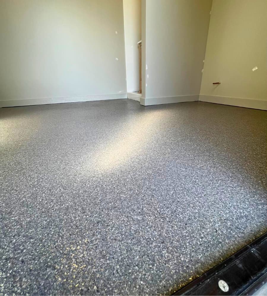 Residential epoxy floor coating installed in Omaha basement by ConcreteAid